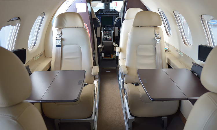 Interior configuration of Phenom 100, a light jet available for charter